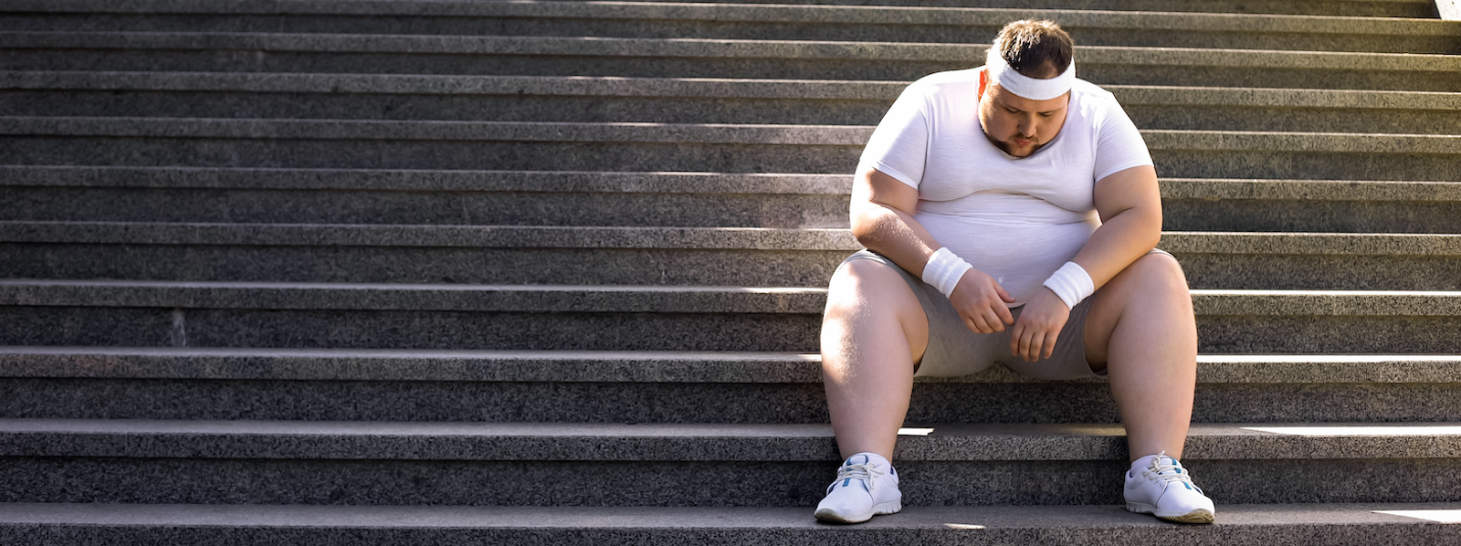 obese man on stairs